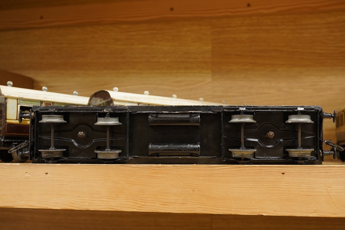 Five 0 gauge tinplate LNWR bogie coaches; four Bing for Bassett-Lowke 1921 series coaches; three Full First corridor coaches, and a Brake Third, together with a Carette 12-wheel Dining Saloon, 13210, all in chocolate and